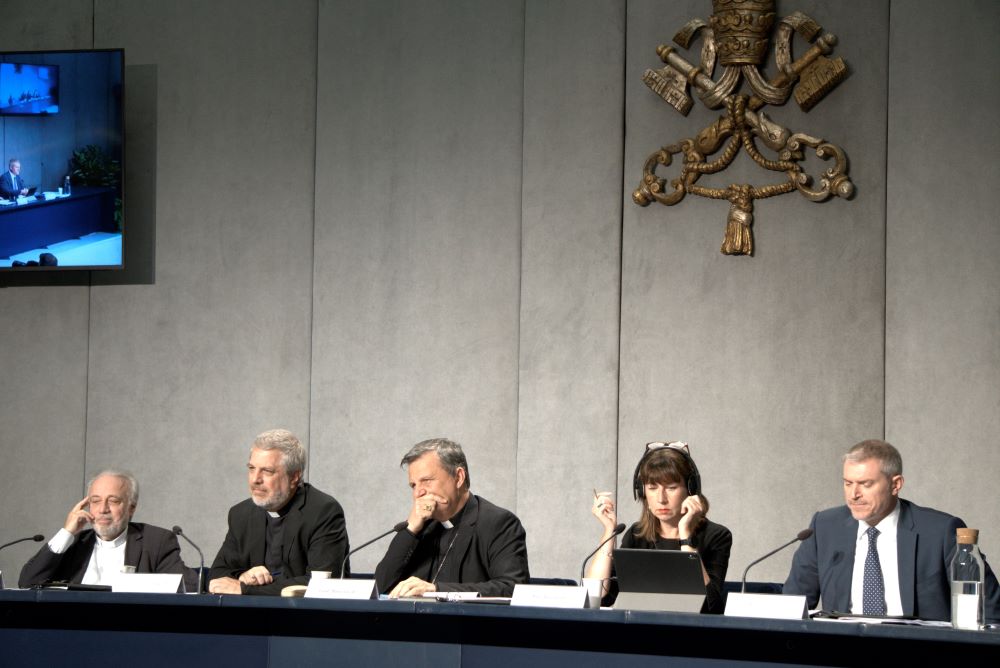 Italian Jesuit Father Giacomo Costa, second from left, adviser to the secretary-general of the synod, speaks at a news conference at the Vatican Oct. 27 to present the document for the continental phase of the Synod of Bishops on synodality.