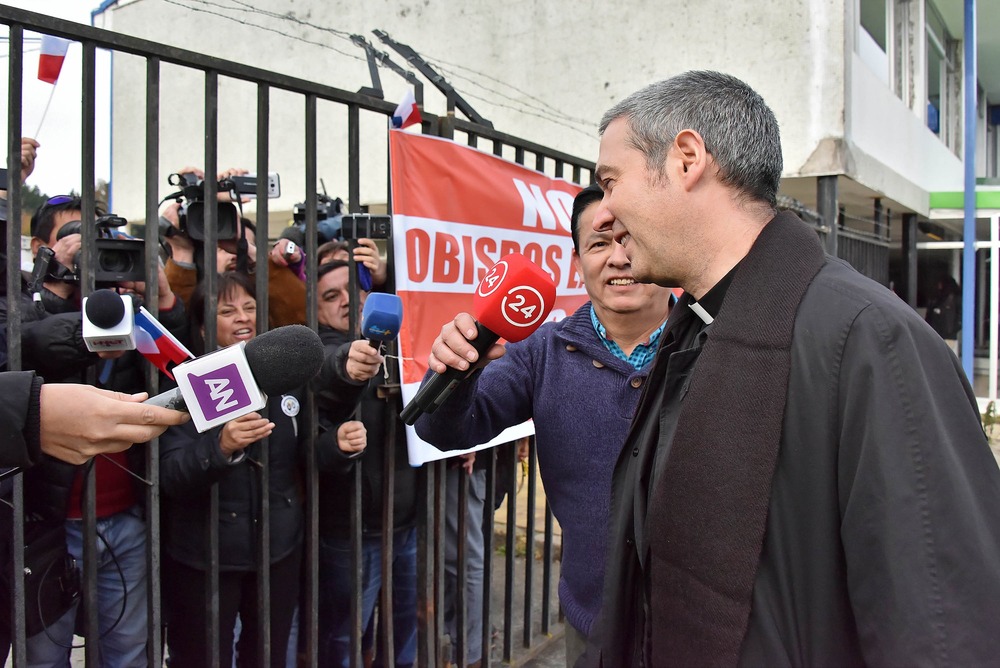 Msgr. Jordi Bertomeu Farnos, Osorno, Chile, June 14, 2018. Msgr. Jordi Bertomeu Farnos smiles while talking to reporters.