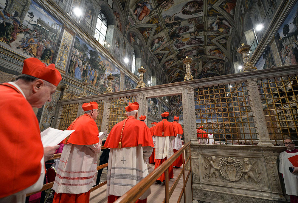 Cardinals from around the world enter the Vatican's Sistine Chapel March 12, 2013, as they begin the conclave to elect a successor to Pope Benedict XVI. (CNS/L'Osservatore Romano via Reuters)