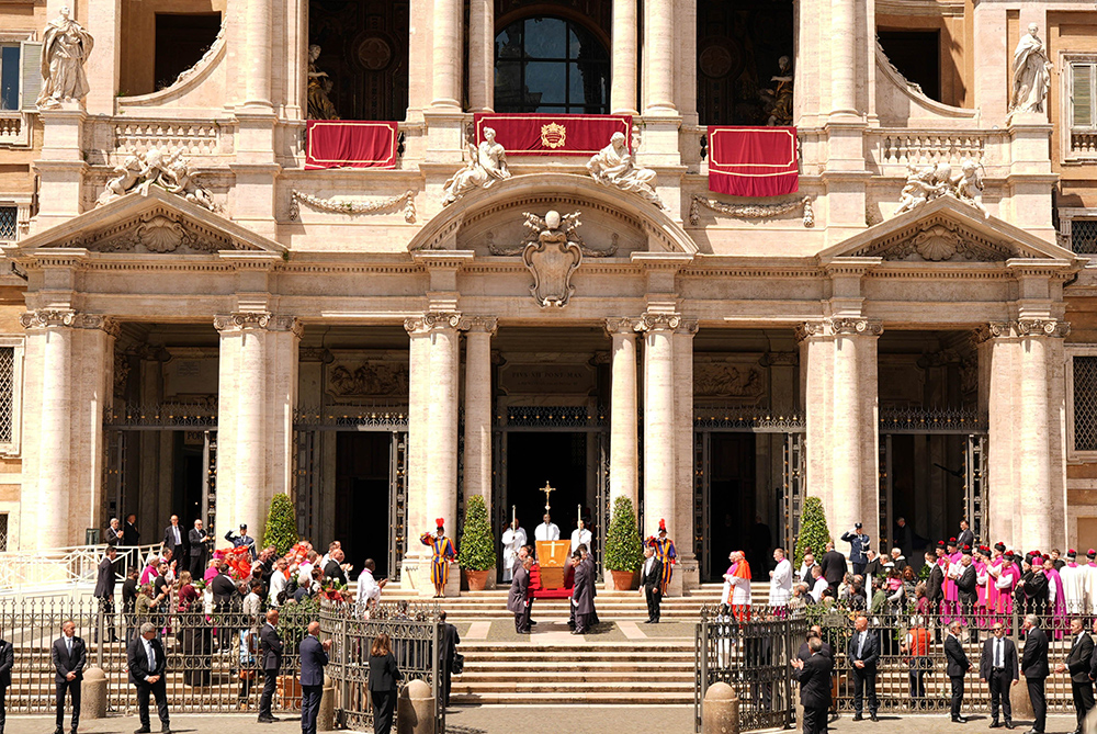 Pallbearers carry the casket of Pope Francis into the Basilica of St. Mary Major in Rome April 26, 2025, ahead of his burial. The pope requested to be buried in the Marian basilica following his funeral Mass at the Vatican. (CNS/Lola Gomez)
