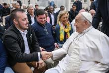 On Oct. 23, Maxwell Kuzma meets Pope Francis after a general audience as part of a group of transgender Catholic men gathered through Outreach. (Courtesy of Outreach)
