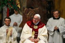 Pope Francis smiles during Mass at the Society of Jesus' Church of the Gesù in Rome Jan. 3, 2014. The pope celebrated Mass with 300 of his Jesuit confreres in thanksgiving for the canonization of Jesuit St. Peter Faber. (CNS/Paul Haring)