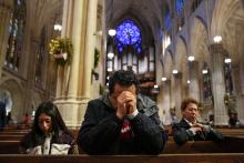 A man prays at St. Patrick's Cathedral in New York City April 21, 2025, after the death of Pope Francis was announced by the Vatican. Pope Francis, formerly Argentine Cardinal Jorge Mario Bergoglio, died April 21 at age 88. (OSV News/Reuters/Adam Gray)