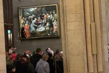 Mass attendees fill Notre-Dame de Paris on April 23, two days after Pope Francis died at age 88. The painting is "The Nativity" by Jérôme Francken. (NCR photo/Jason Berry)
