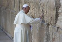 Pope Francis prays in front of the Western Wall, in Jerusalem's Old City May 26, 2014. (AP Photo/Oded Balilty, File)