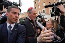 Cardinal François-Xavier Bustillo of Ajaccio, France, is surrounded by members of the media as he approaches the Petriano entrance next to St. Peter’s Square to attend a general congregation meeting in the New Synod Hall at the Vatican April 25, 2025. (CNS/Lola Gomez)